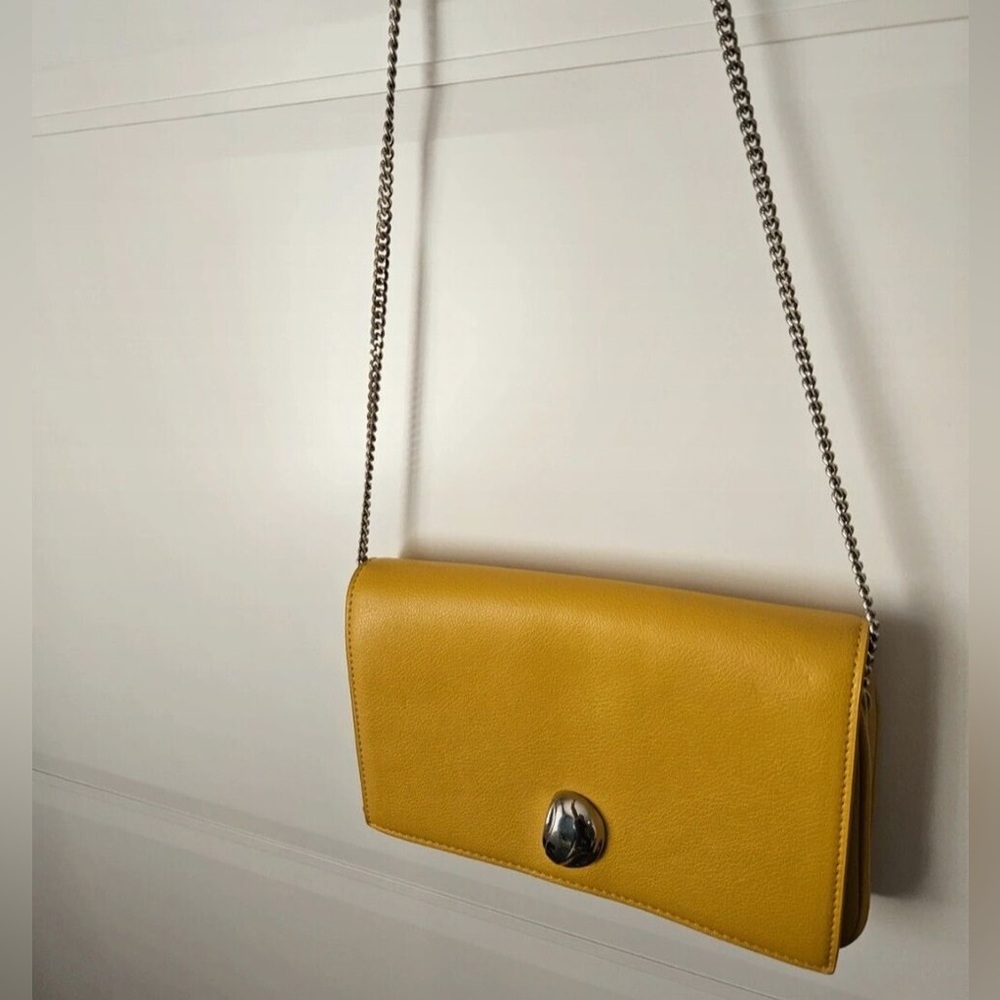 Yellow Zara crossbody flap bag.